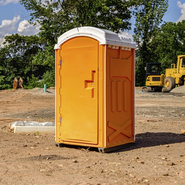 how often are the porta potties cleaned and serviced during a rental period in Champaign